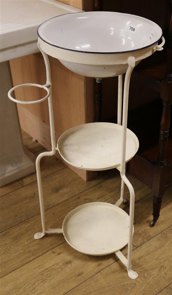 A late Victorian white enamelled wash basin, combined iron stand W.45cm